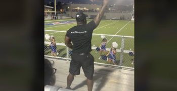 cheer dad dancing in football stands